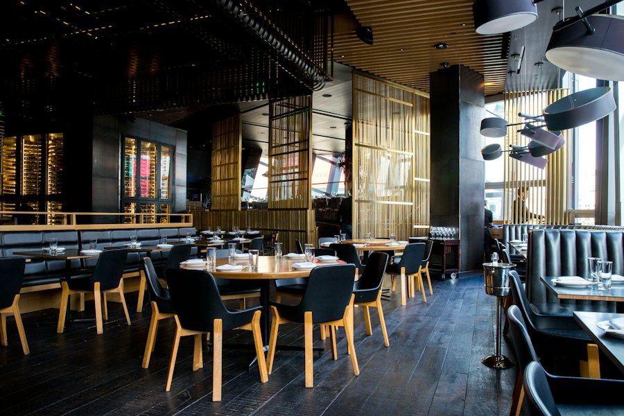 Warm lighting over the restaurant seating